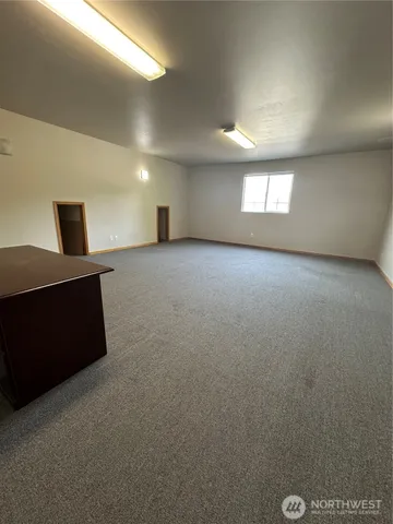 a view of empty room with windows