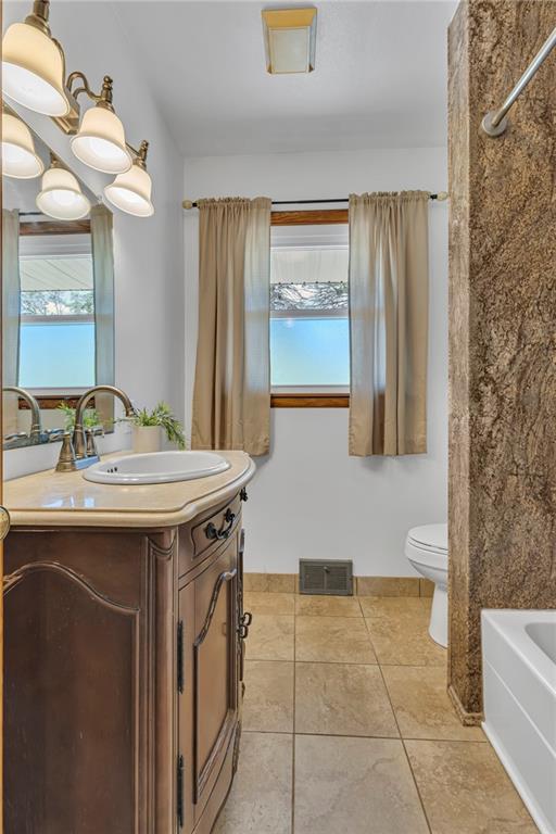 383 Ridgemont Drive Midland, PA 15059 - Photo 31 of 44 a bathroom with a granite countertop sink and a mirror