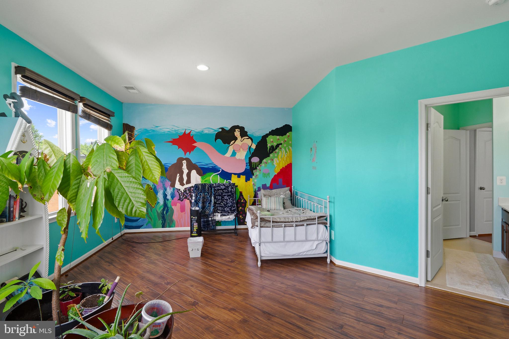 8925 Quarry Road Manassas, VA 20110 - Photo 38 of 63 Vibrant mural in a serene bedroom.