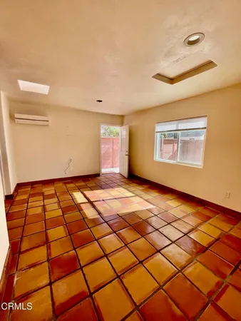 a view of an empty room and window