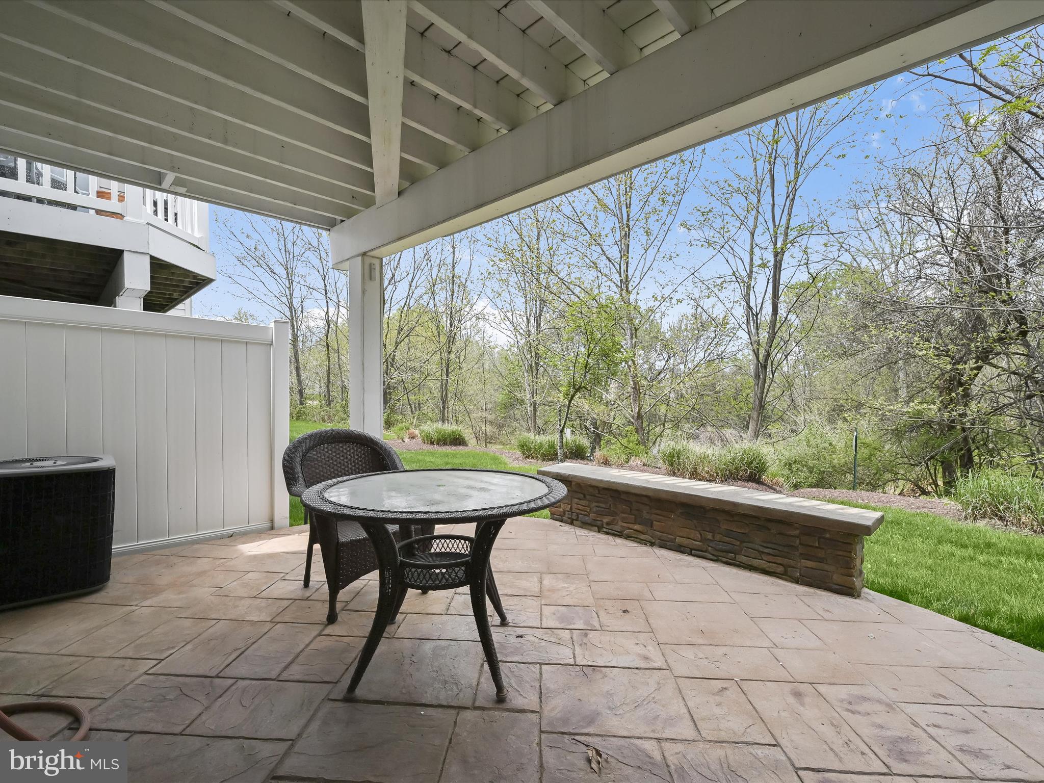 8214 Academy Road, Unit 25 Ellicott City, MD 21043 - Photo 51 of 64 Shaded, stamped concrete patio