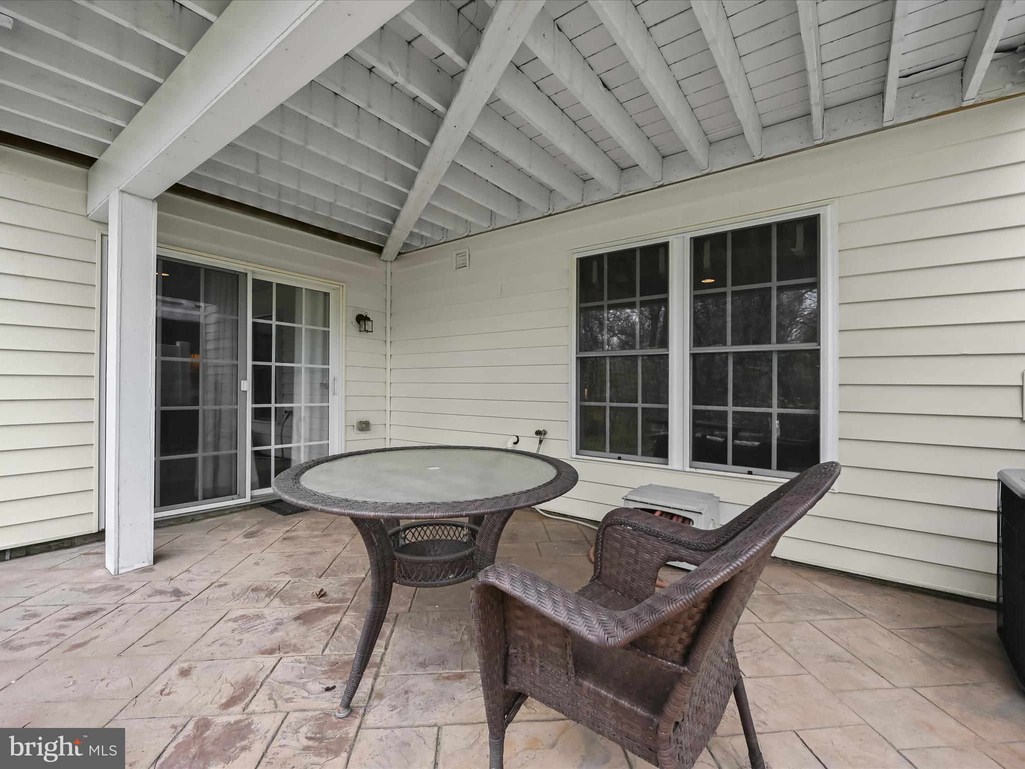 8214 Academy Road, Unit 25 Ellicott City, MD 21043 - Photo 52 of 64 Shaded, stamped concrete patio