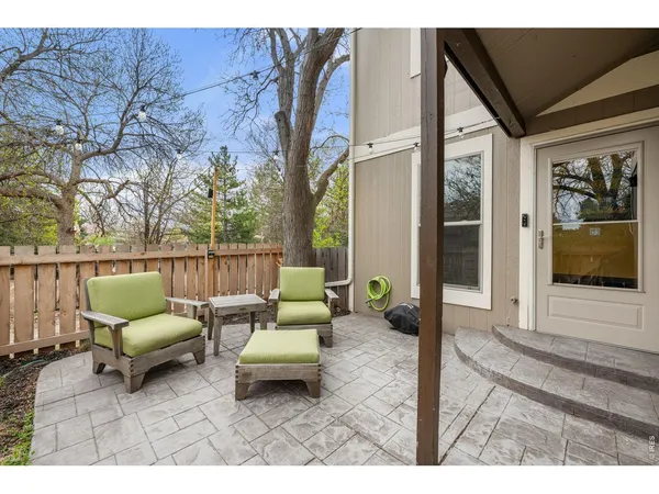 a outdoor space with patio the couches and a dining table with garden view