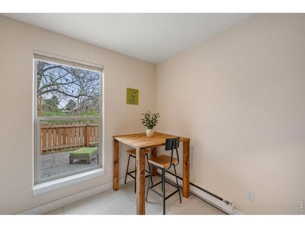 a workspace room with furniture and wooden floor