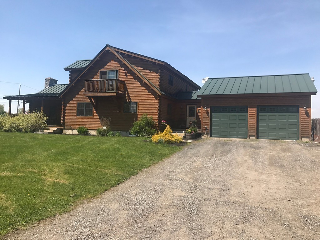 944 George Hill Road Lancaster, MA 01523 - Photo 12 of 22 a front view of a house with a yard and garage