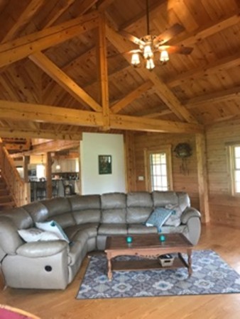944 George Hill Road Lancaster, MA 01523 - Photo 14 of 22 a living room with furniture and a chandelier