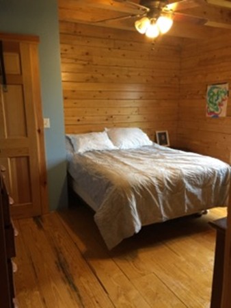 944 George Hill Road Lancaster, MA 01523 - Photo 20 of 22 a bedroom with a bed and a view of bathroom