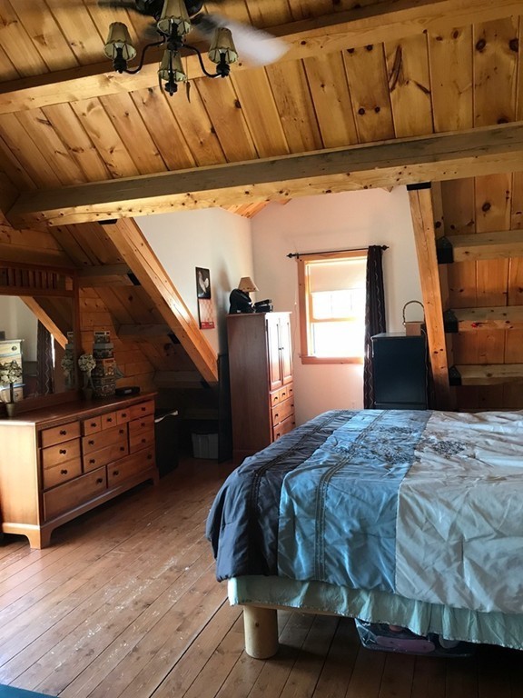 944 George Hill Road Lancaster, MA 01523 - Photo 6 of 22 a bedroom with a bed and a dresser