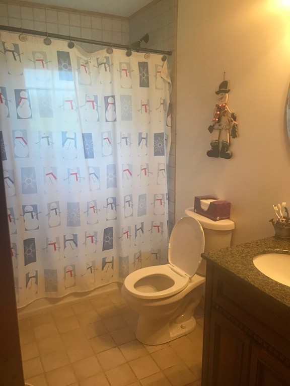 944 George Hill Road Lancaster, MA 01523 - Photo 10 of 22 a bathroom with a granite countertop toilet sink and shower