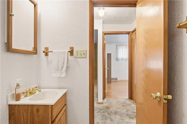 a bathroom with a sink and mirror