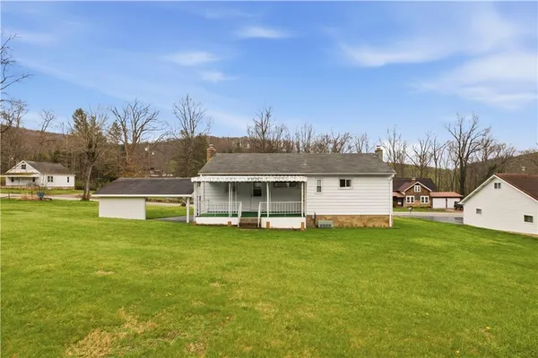 a view of a house with a big yard