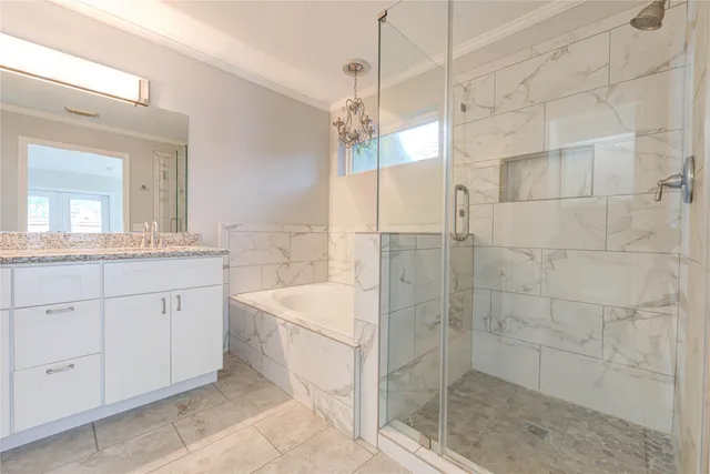 a bathroom with a double vanity sink a toilet a mirror and shower