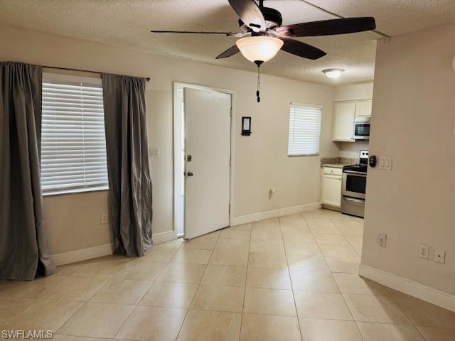 3325 Airport Road North, Unit J3 Naples, FL 34105 - Photo 3 of 13 a view of a kitchen with a sink and a refrigerator