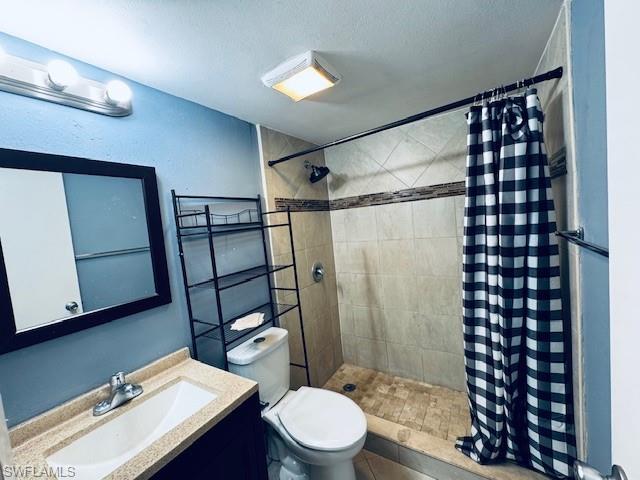 3325 Airport Road North, Unit J3 Naples, FL 34105 - Photo 4 of 13 a bathroom with a sink a toilet a mirror and shower