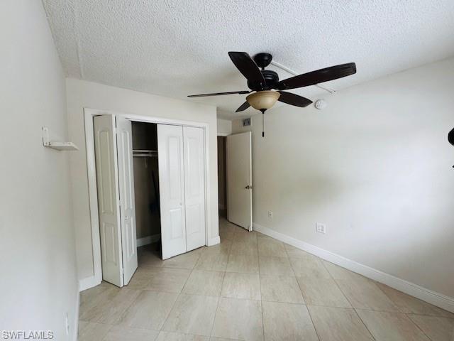 3325 Airport Road North, Unit J3 Naples, FL 34105 - Photo 8 of 13 an empty room with a ceiling fan and carpet