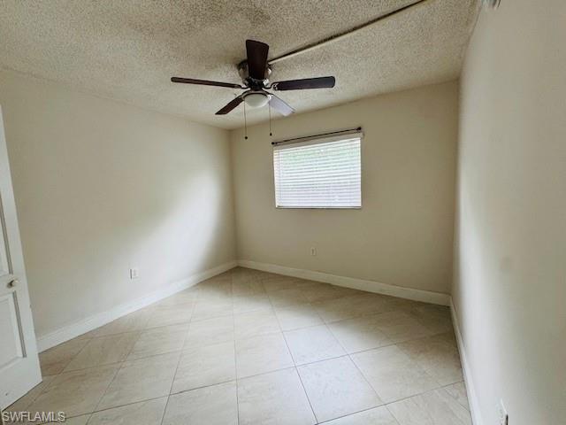 3325 Airport Road North, Unit J3 Naples, FL 34105 - Photo 9 of 13 a view of a big room with wooden floor and chandelier fan