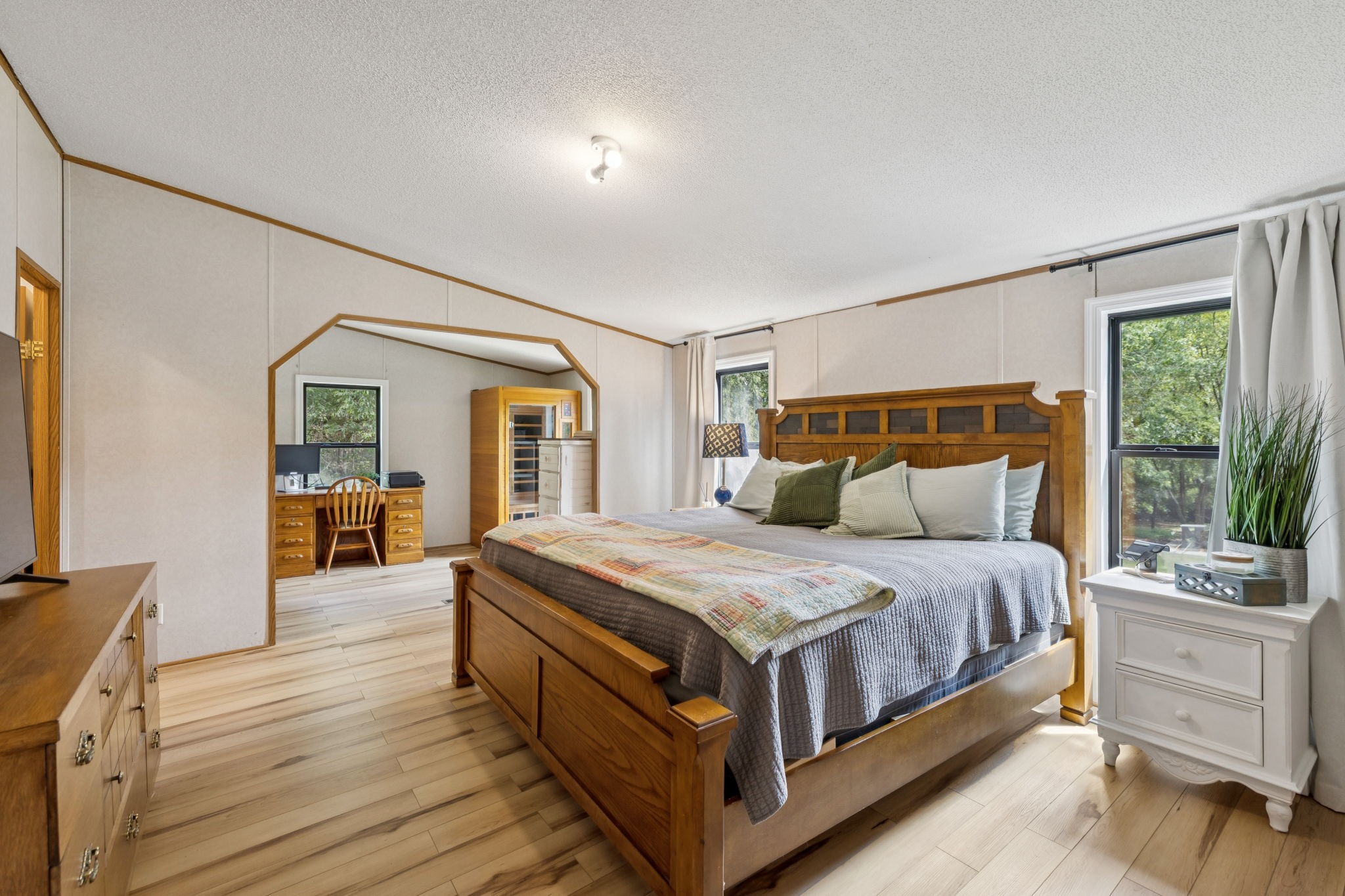 3680 Clark Road Lewisburg, TN 37091 - Photo 26 of 37 a bedroom with a large bed and a flat tv screen on dresser