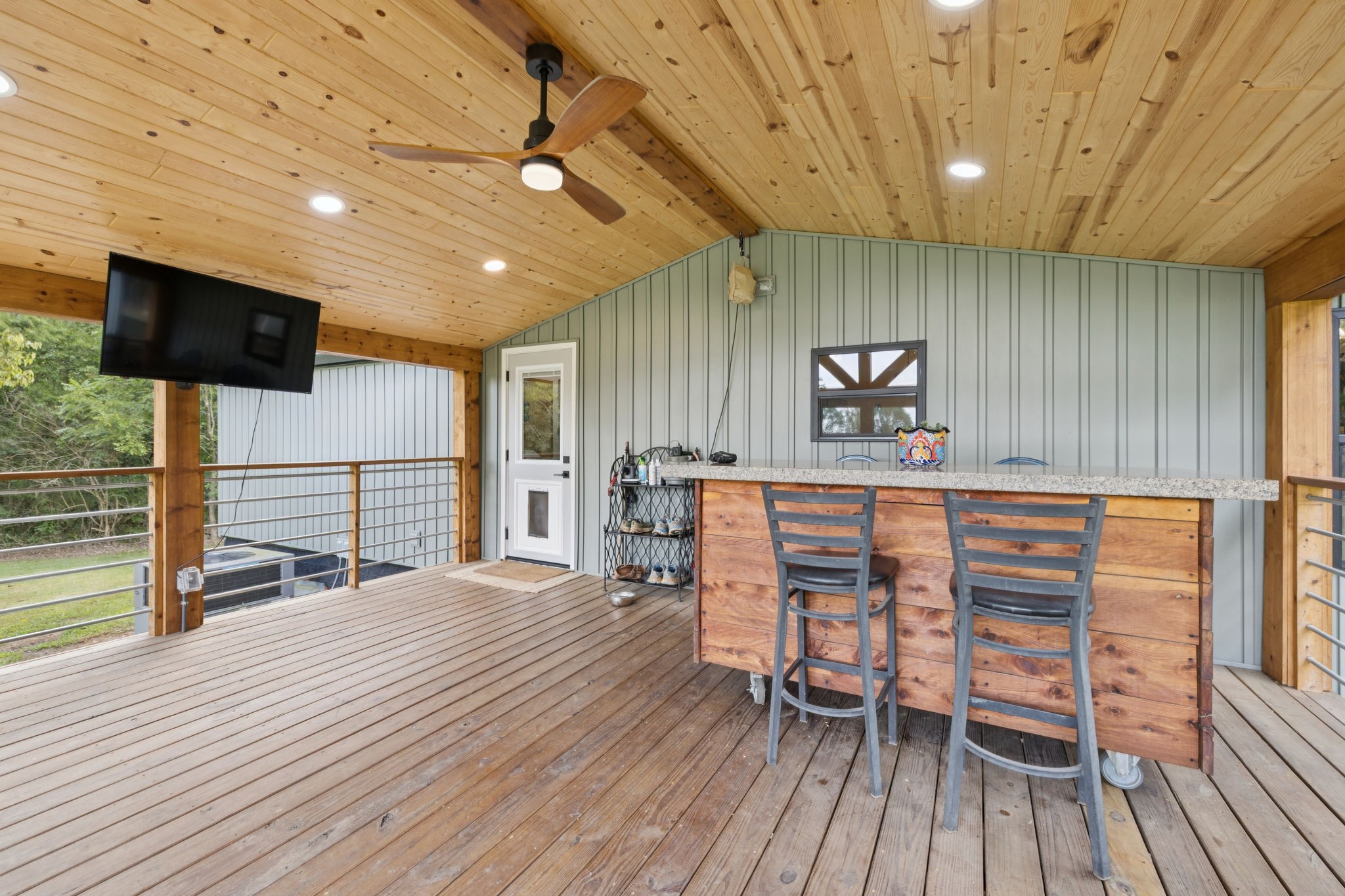 3680 Clark Road Lewisburg, TN 37091 - Photo 36 of 37 a kitchen with stainless steel appliances kitchen island granite countertop a stove a refrigerator a dining table and chairs with wooden floor