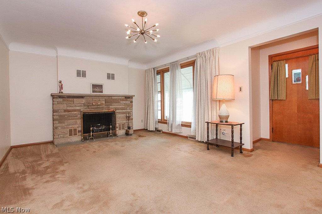 14579 Pease Road Maple Heights, OH 44137 - Photo 4 of 30 Living room with wood burning fireplace.