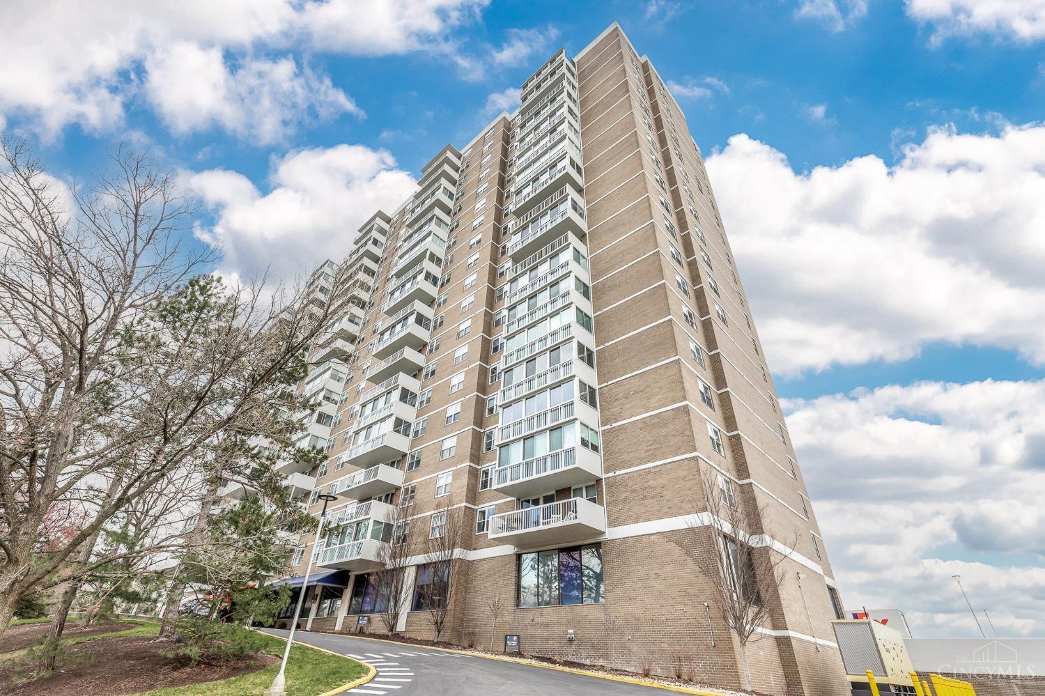 2444 Madison Road, Unit 901 Cincinnati, OH 45208 - Photo 1 of 44 Enjoy carefree living in this spacious + bright 1,700+ SF 2 BR, 2 full BA condo at The Regency. This sought after east-facing unit offers beautiful panoramic views of Hyde Park. Key features include updated lighting, new carpet + paint throughout. The large well-appointed living room w/wall-mounted fireplace is open to the dining room w/walkout access to the covered terrace. The KIT has been nicely updated and features granite countertops, stainless steel appliances, a sizable walk-in pantry and crisp white cabinetry. The expansive owner’s suite offers an abundance of closet space (including two walk-ins), a dressing area + ensuite BA. Enjoy the outdoors and take in the view from the private covered terrace. Also included is 1 convenient assigned GAR parking space + access to a private storage locker. The Regency is a secure full-service building w/amenities galore including an exercise facility, pool, restaurant, salon, valet parking, concierge, 24 hour doorman and more.