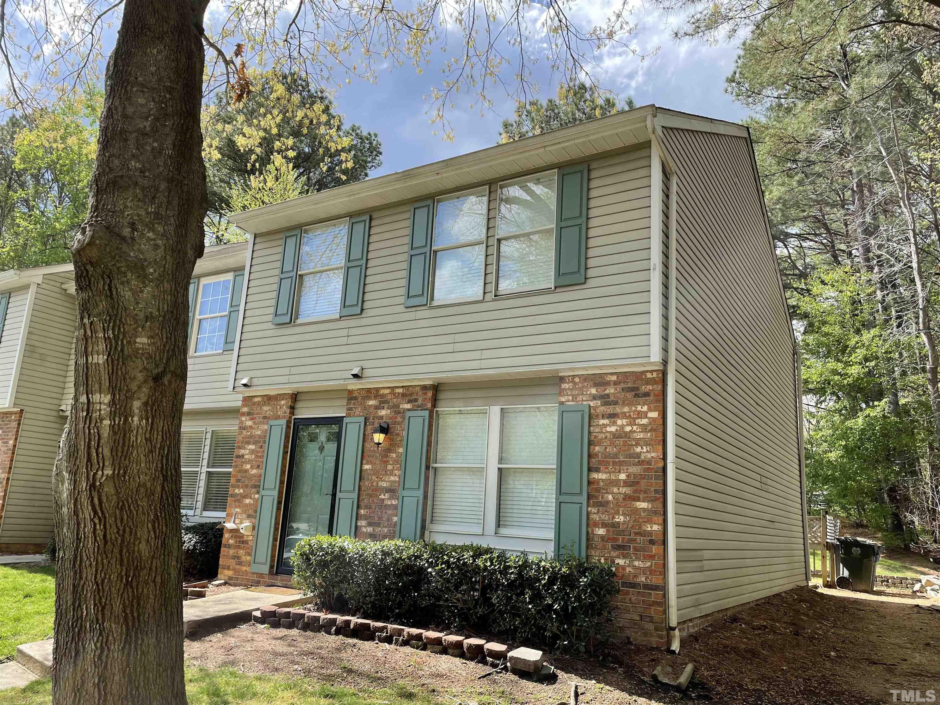 7841 Stephanie Lane Raleigh, NC 27615 - Photo 2 of 37 front view of a house with a yard