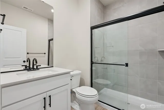 a kitchen with kitchen island a stove a sink and a refrigerator