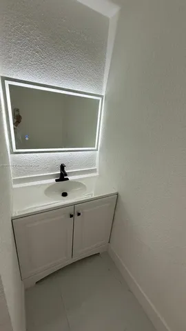 a bathroom with a sink and a toilet