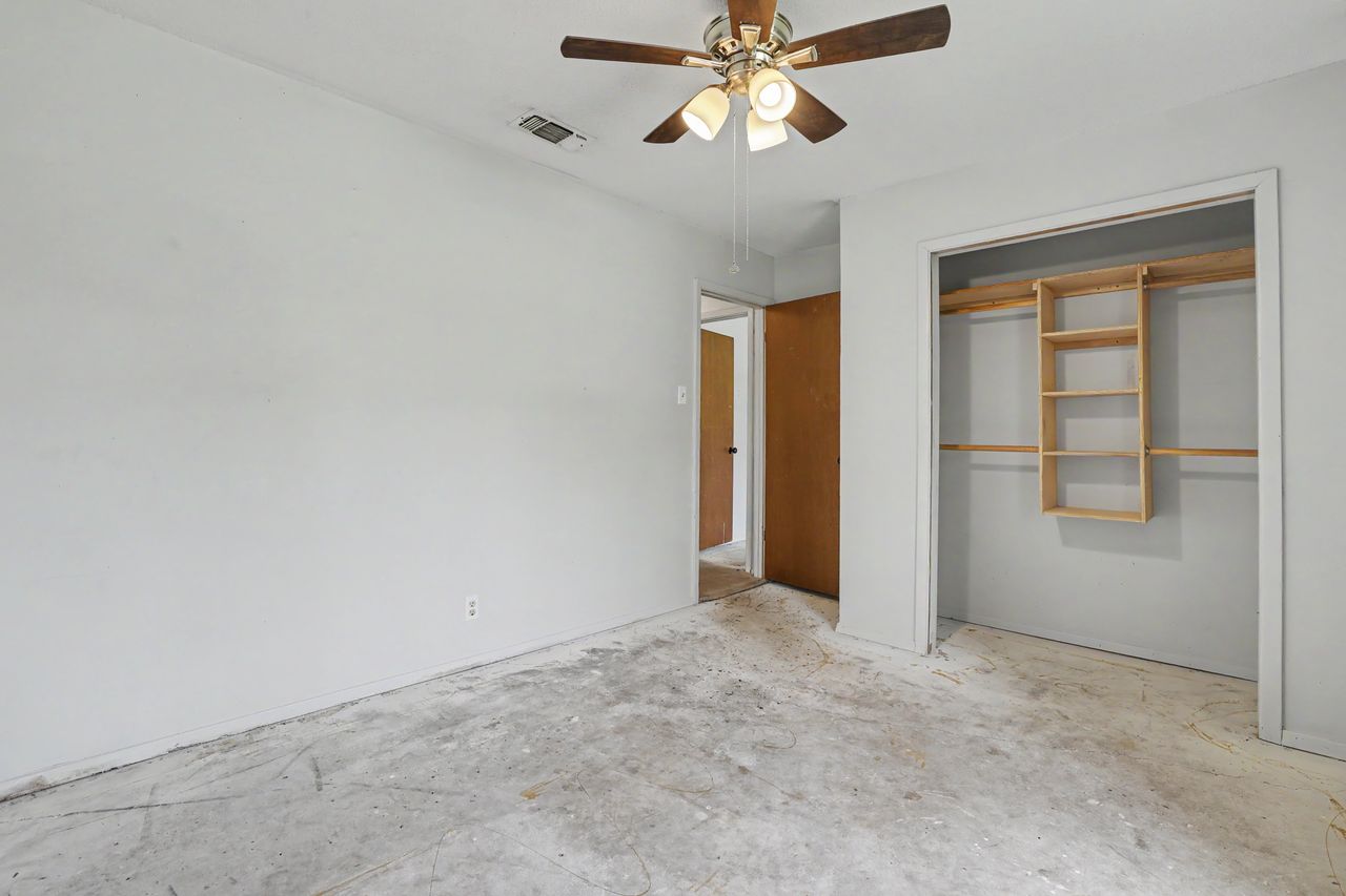 1811 Terry Lane Georgetown, TX 78628 - Photo 27 of 40 Ready for your personal touches, this versatile room includes a ceiling fan and a built-in closet with shelving.