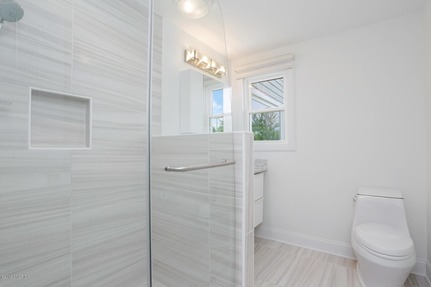 52 Arcadia Road Old Greenwich, CT 06870 - Photo 11 of 28 a bathroom with a toilet and a shower