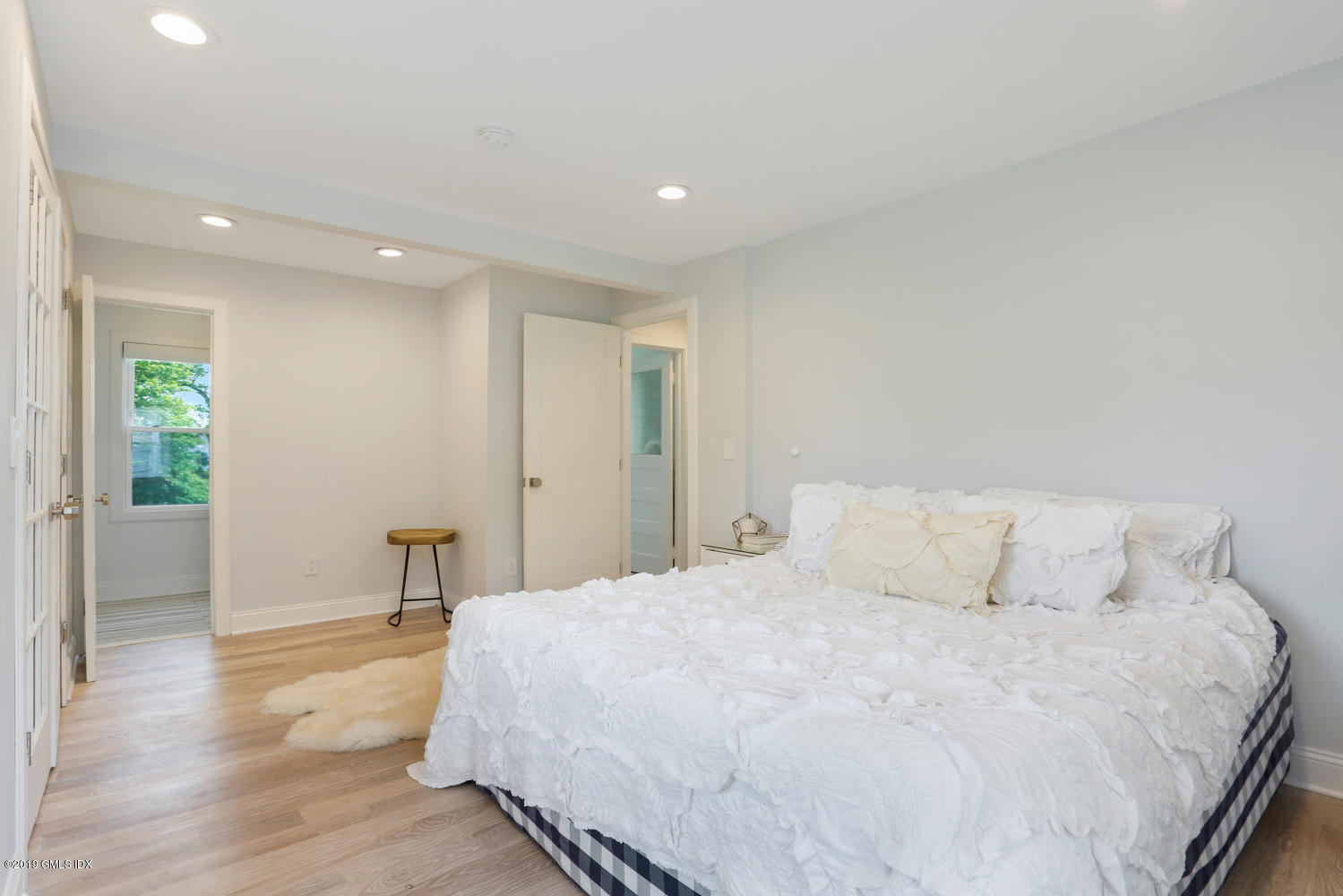 52 Arcadia Road Old Greenwich, CT 06870 - Photo 12 of 28 a large white bed in a white room