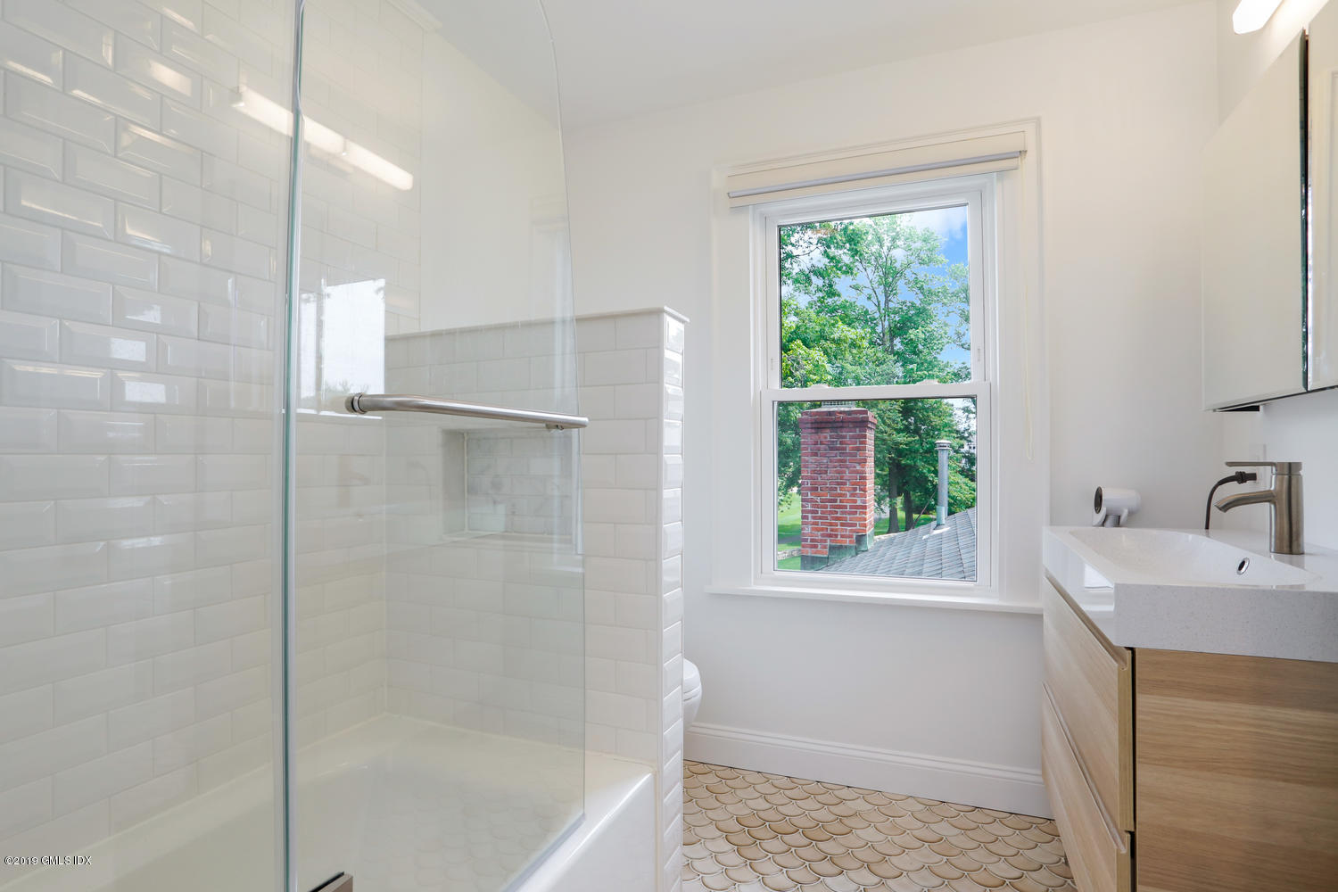 52 Arcadia Road Old Greenwich, CT 06870 - Photo 19 of 28 a bathroom with a bathtub and a sink