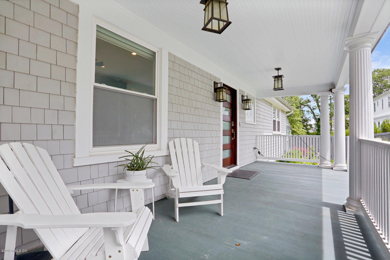 52 Arcadia Road Old Greenwich, CT 06870 - Photo 24 of 28 a living room with furniture and a potted plant