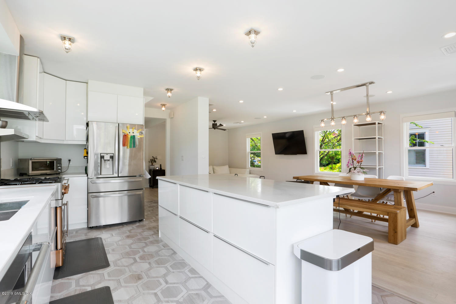52 Arcadia Road Old Greenwich, CT 06870 - Photo 5 of 28 a kitchen with stainless steel appliances kitchen island granite countertop a sink and a refrigerator