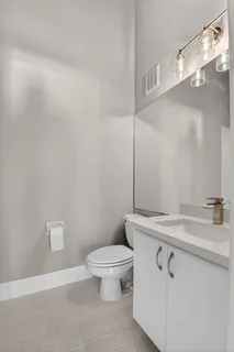 an aerial view of a house with a yard and lake view