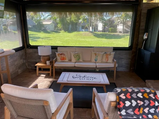 a living room with a couch and a large window