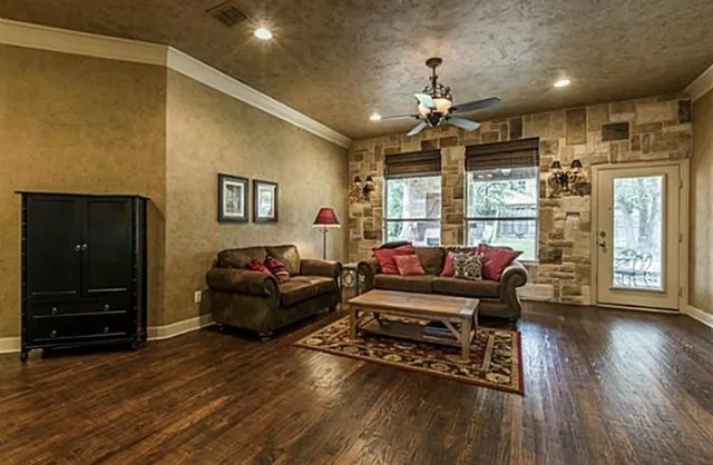 a living room with furniture and a flat screen tv