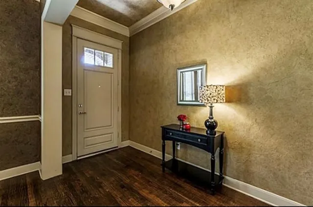 a room that has a bed and a window in it