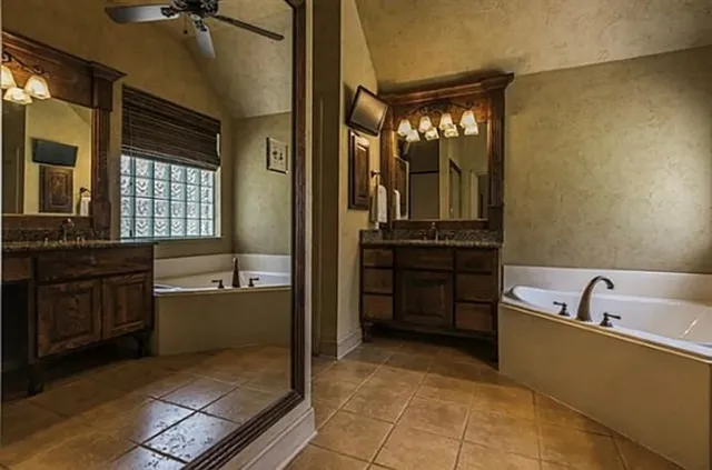 a living room with furniture a ceiling fan and a rug
