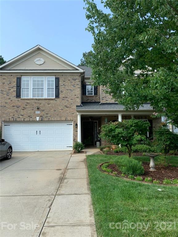2074 Durand Road Fort Mill, SC 29715 - Photo 1 of 1 a front view of a house with a garden