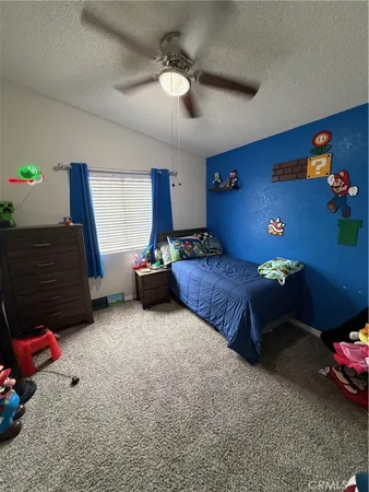a bedroom with furniture and a chandelier