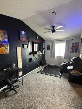 a living room with furniture window and a flat screen tv