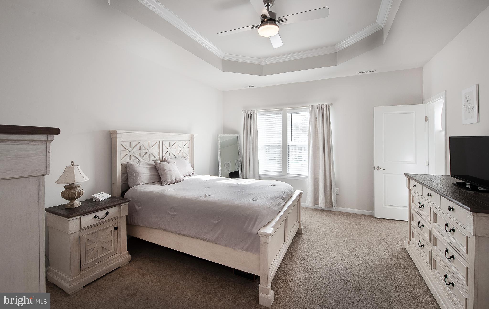 2804 Lamington Court Clarksboro, NJ 08020 - Photo 13 of 24 a bedroom with a bed and a flat tv screen on dresser