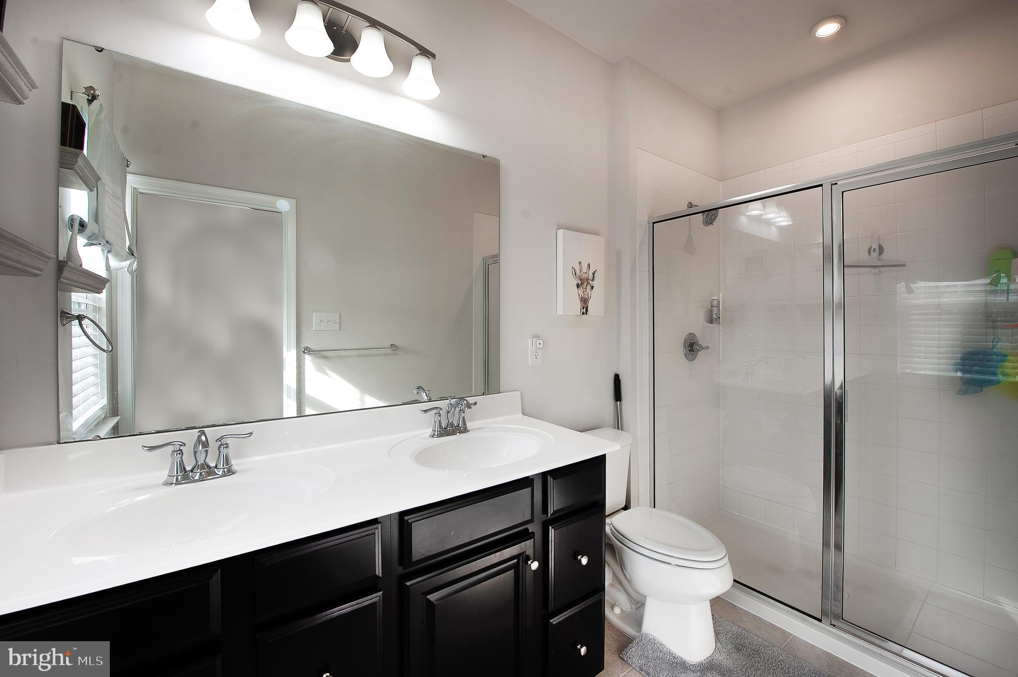 2804 Lamington Court Clarksboro, NJ 08020 - Photo 15 of 24 a bathroom with a sink toilet a mirror and shower