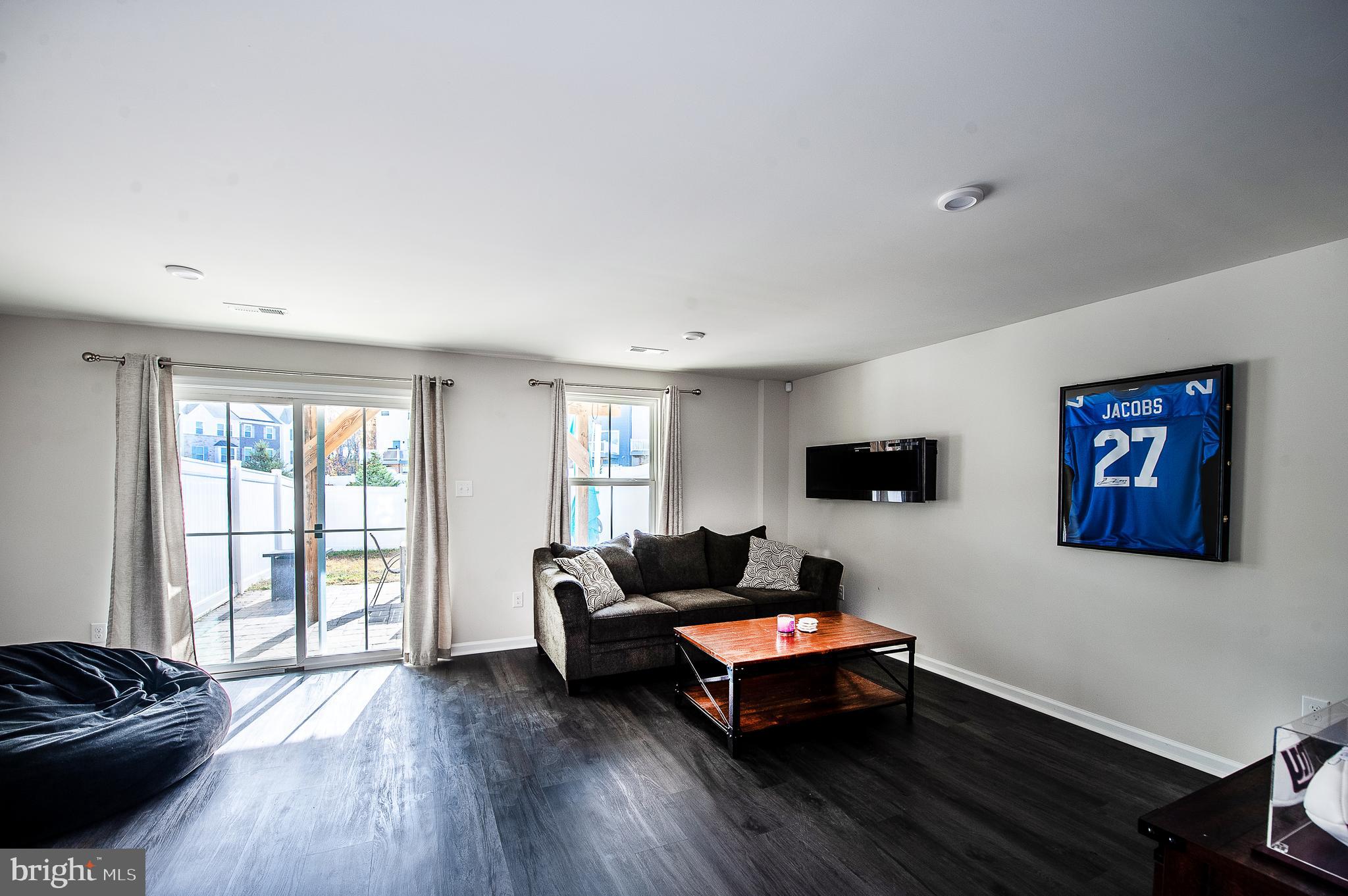 2804 Lamington Court Clarksboro, NJ 08020 - Photo 21 of 24 a living room with furniture flat screen tv and a large window