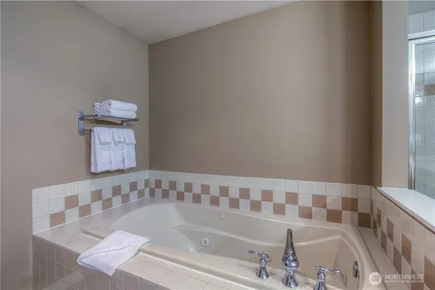 a bathroom with a bathtub and a shower
