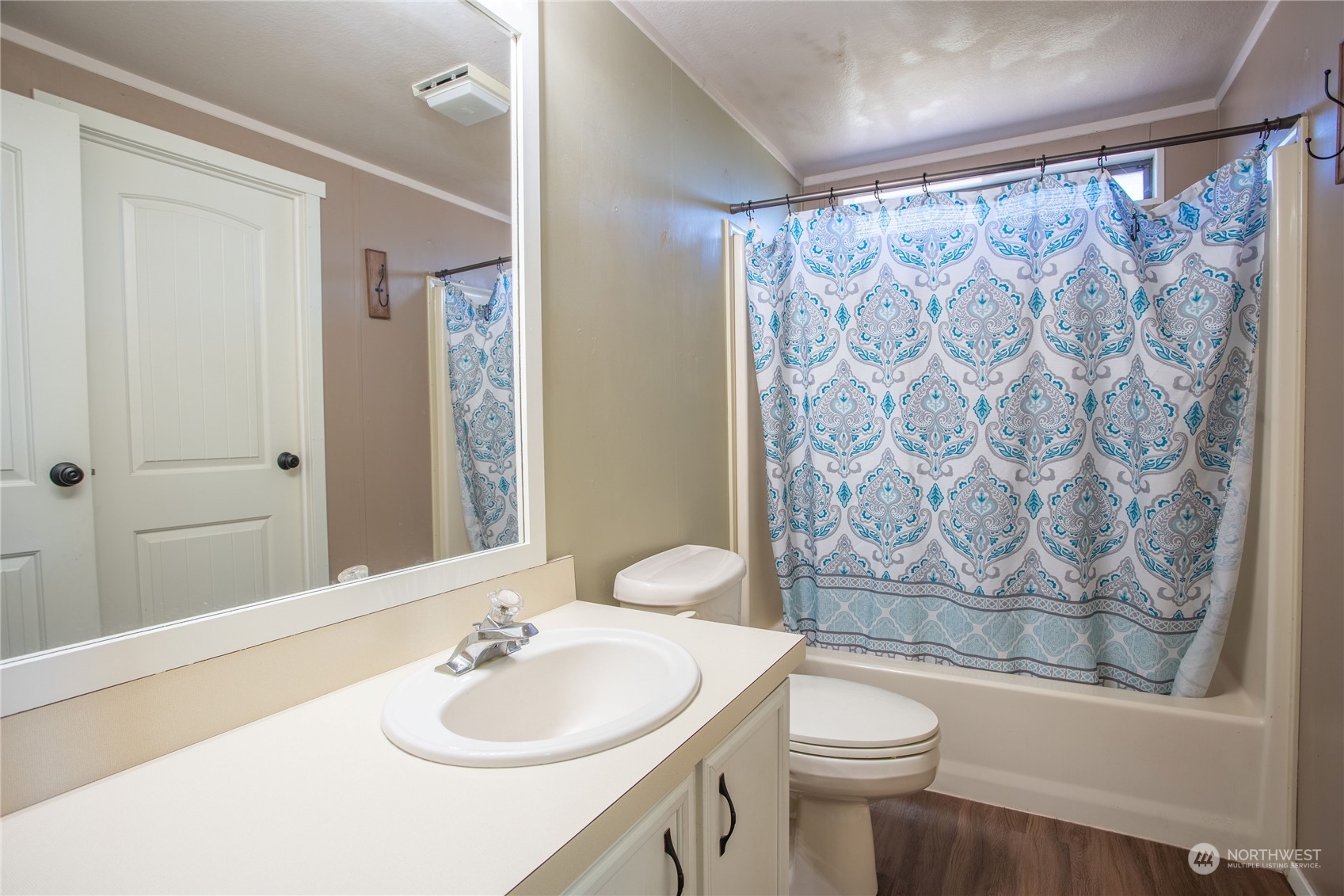 1040 Shorey Road Chehalis, WA 98532 - Photo 17 of 38 a bathroom with a sink a toilet and shower curtain