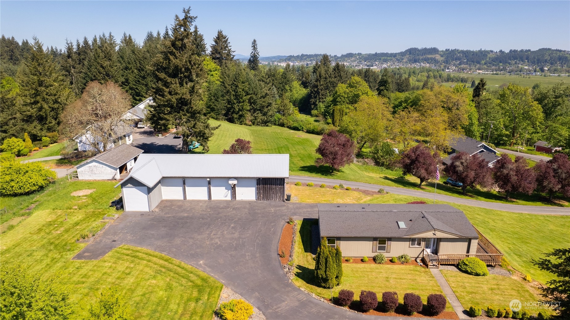 1040 Shorey Road Chehalis, WA 98532 - Photo 22 of 38 an aerial view of a house with swimming pool and mountains