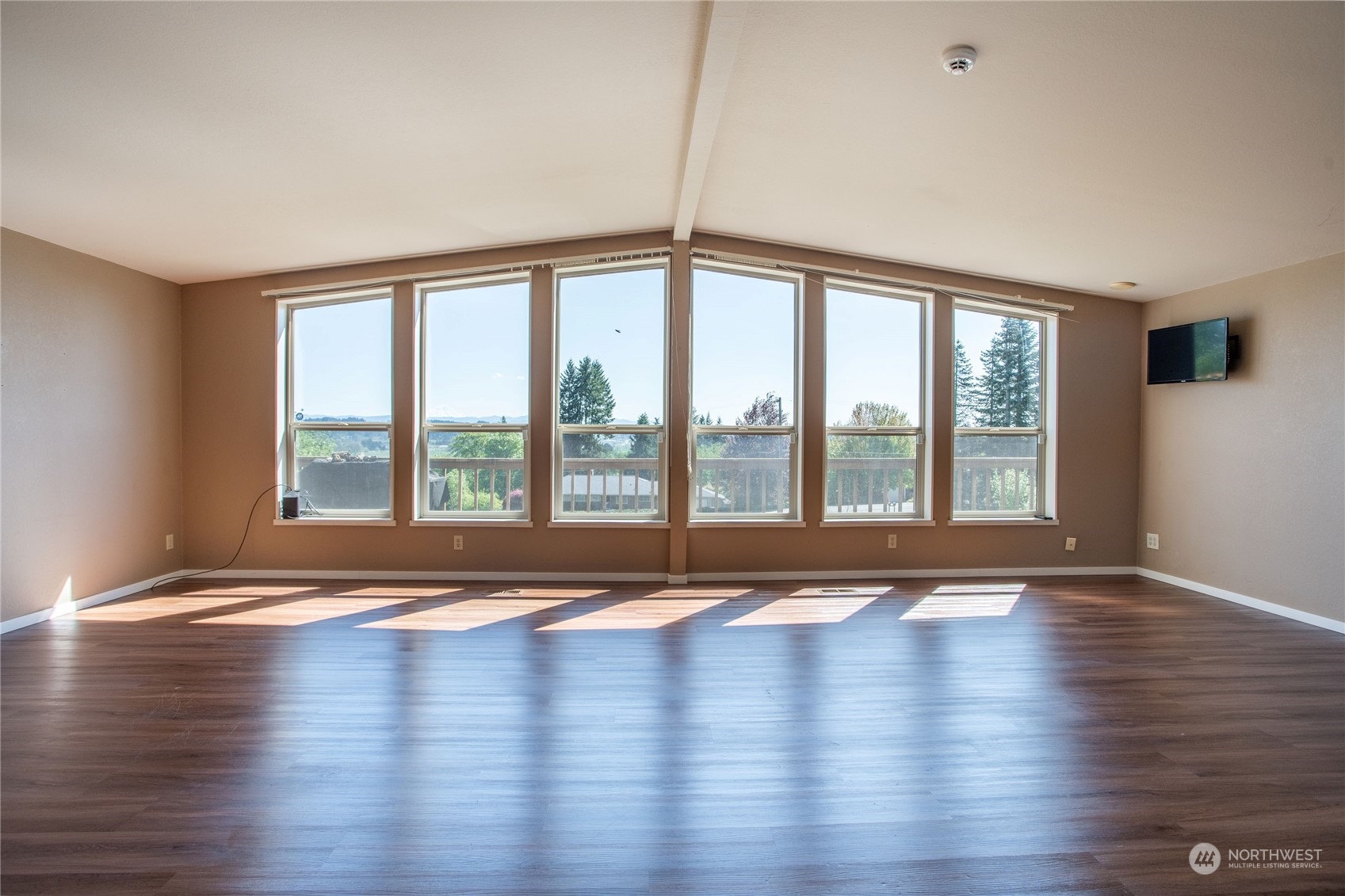 1040 Shorey Road Chehalis, WA 98532 - Photo 5 of 38 a view of empty room with wooden floor and floor to ceiling window