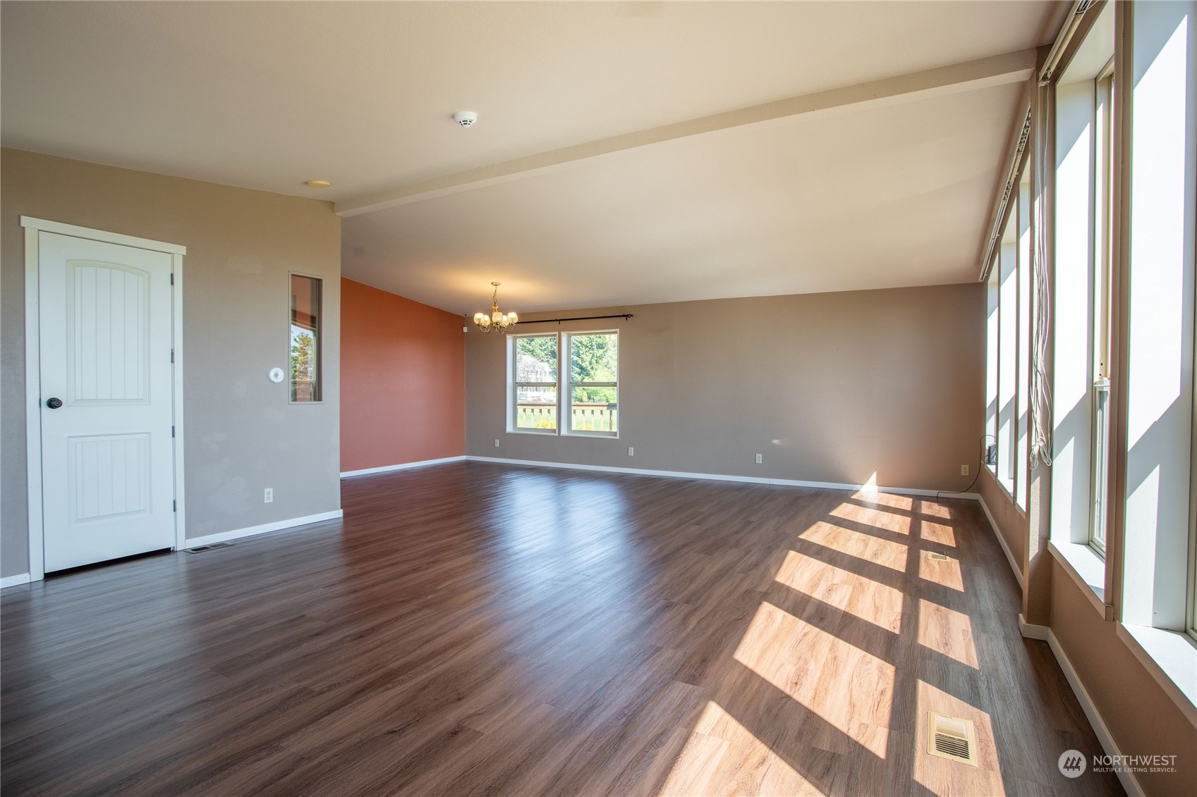 1040 Shorey Road Chehalis, WA 98532 - Photo 6 of 38 an empty room with wooden floor and windows