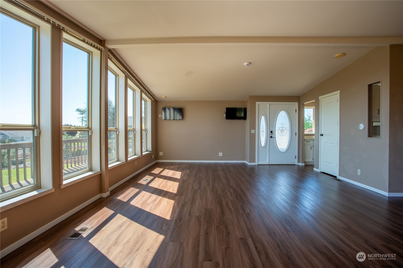1040 Shorey Road Chehalis, WA 98532 - Photo 7 of 38 a view of an empty room with wooden floor and a window